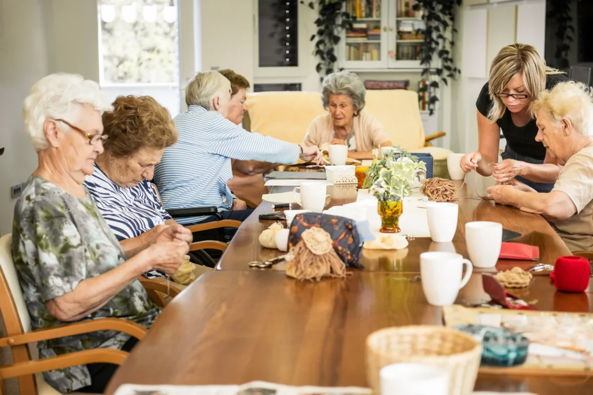what is memory care shown through older adults participating in a supervised group activity with caregiver support.
